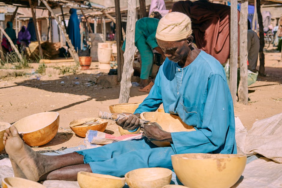 A skilled craftsman carving wooden bowls in a vibrant outdoor market, embodying traditional artistry.