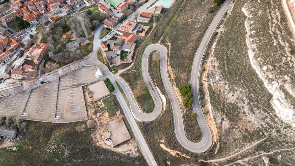 Aerial photograph showcasing winding roads and architecture in Peñafiel, Spain.